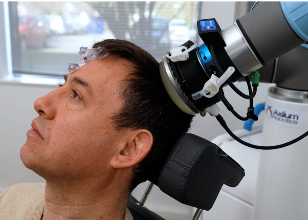 Close view on the transducer applied to a patient's head